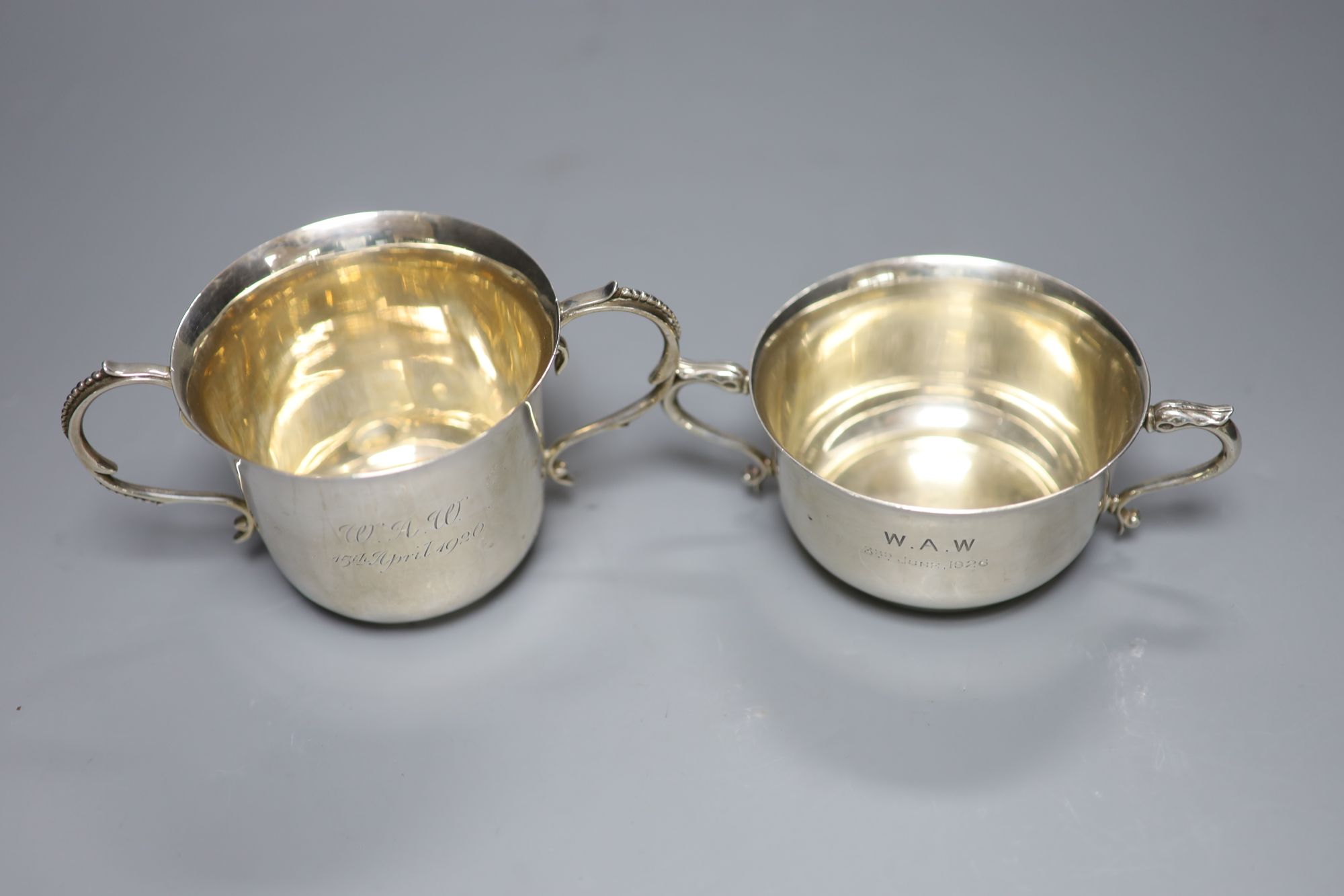 Two George V silver porringers, London, 1921 and Birmingham, 1925, tallest 8cm, gross 10oz.